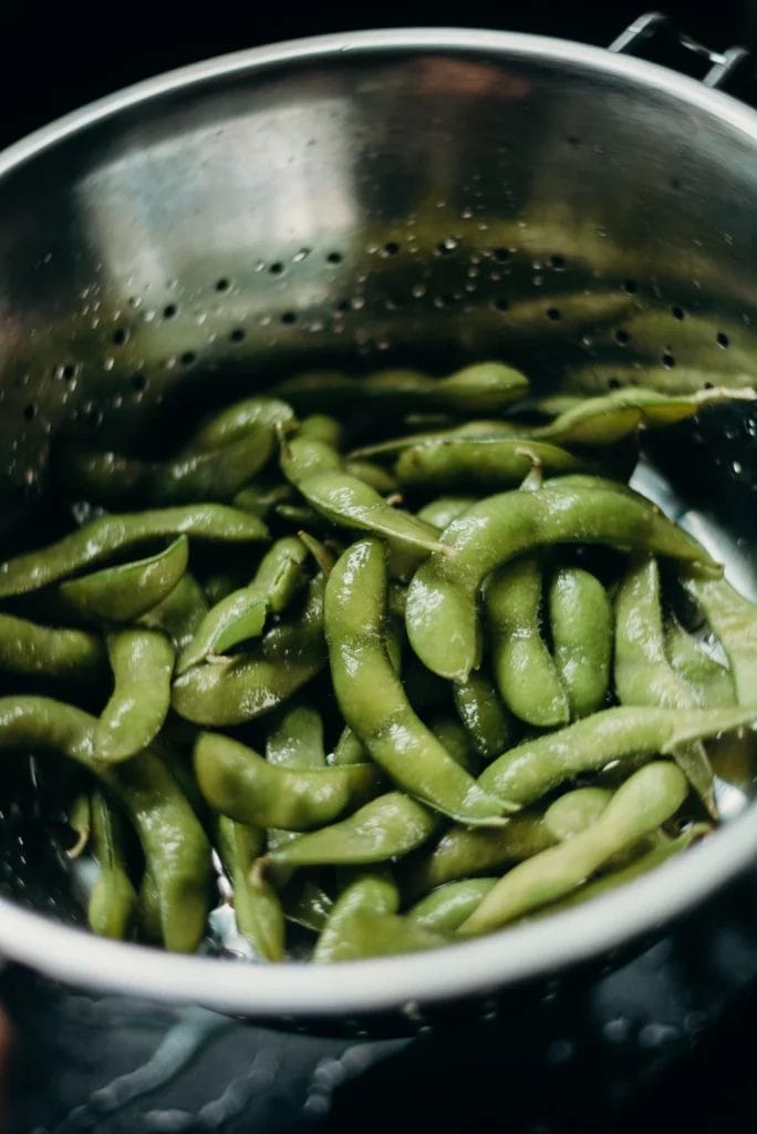 heating up edamame edamame in a sieve