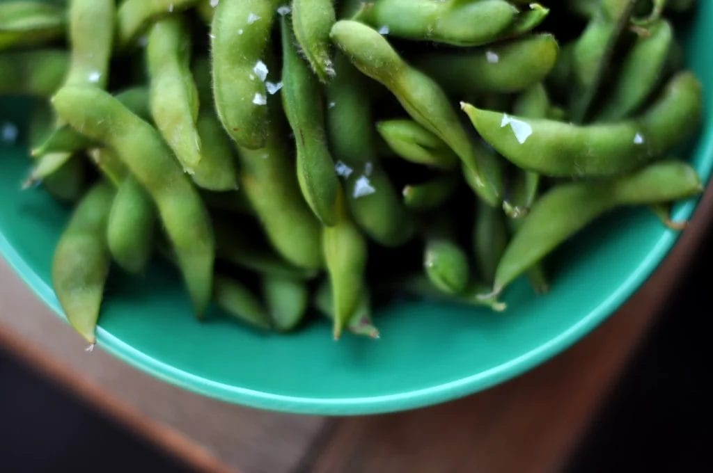 edamame in a green bowl.